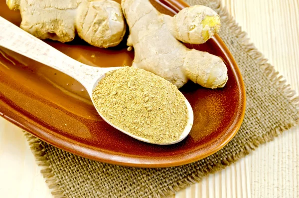 Ginger fresh and dried on a clay plate and burlap — Stock Photo, Image