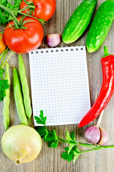 Notebook with vegetables and parsley — Stock Photo, Image