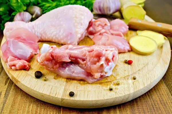 Chicken leg cut on a wooden board — Stock Photo, Image