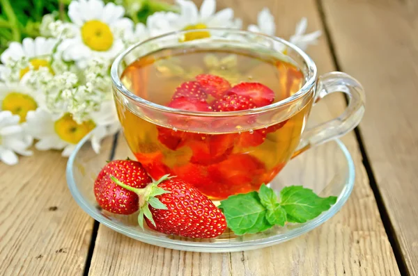 Tea with strawberries on a board — Stock Photo, Image