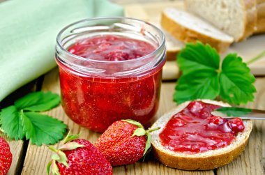 Jam strawberry with bread on the board clipart
