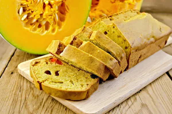 Fruitcake pumpkin with candied fruits on a board — Stock Photo, Image
