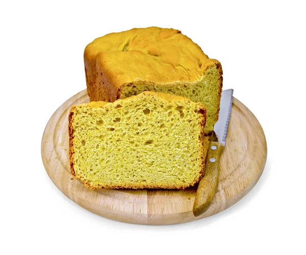 Bread homemade yellow on a round board — Stock Photo, Image