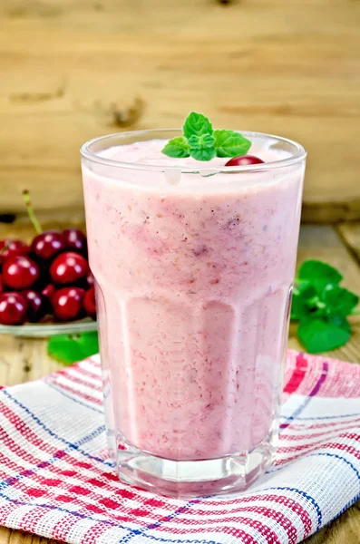 Milk cocktail with cherry on the board — Stock Photo, Image