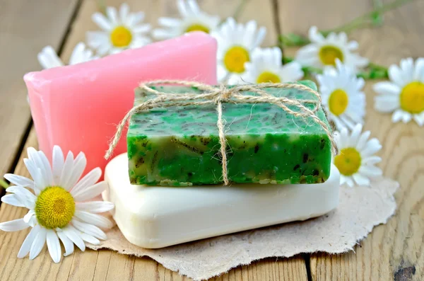Soap homemade with chamomile on a board — Stock Photo, Image