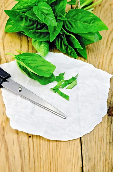 Basil green fresh with scissors on a board — Stock Photo, Image