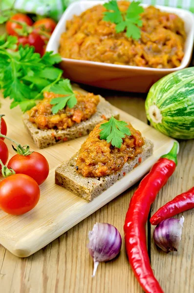 Sandwich with squash caviar and parsley on the board — Stock Photo, Image