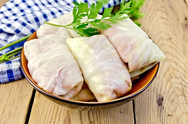 Cabbage stuffed with parsley on the board — Stock Photo, Image
