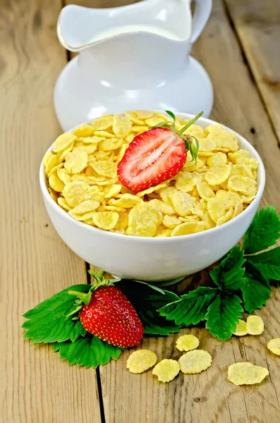 Cornflakes with strawberries and milk on board — Stock Photo, Image