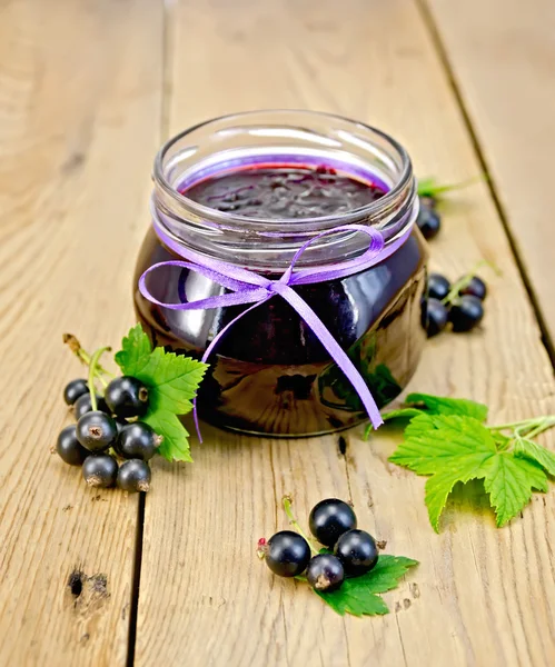 Jam blackcurrant on the board — Stock Photo, Image