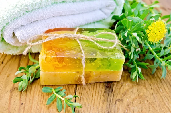 Soap homemade with Rhodiola rosea on board — Stock Photo, Image