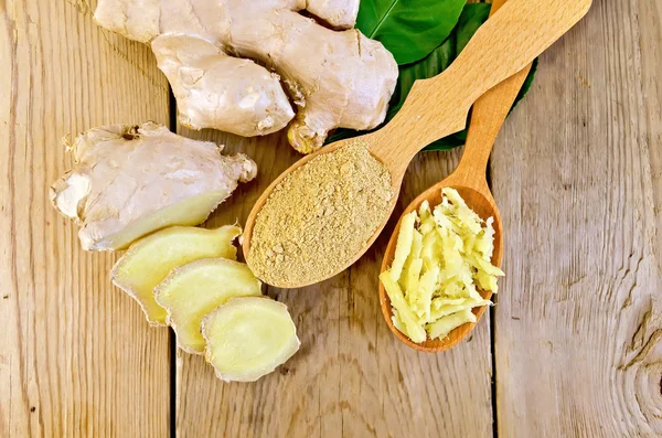 Ginger powder and grated in spoon with root on board — Stock Photo, Image