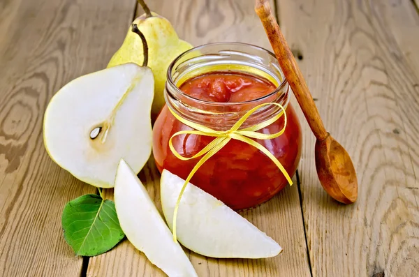 Jam pear with pears and spoon on board — Stock Photo, Image