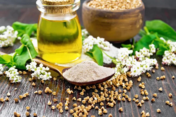 Buckwheat Flour Brown Cereals Spoon Oil Glass Jar Sacking Flowers — стоковое фото