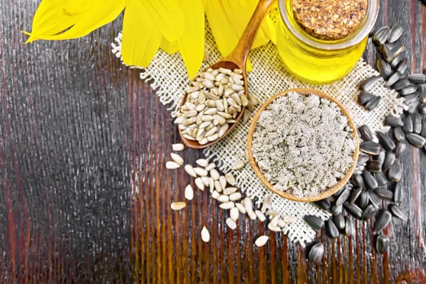 Sunflower Flour Bowl Oil Glass Jar Seeds Spoon Burlap Napkin — Stock Photo, Image