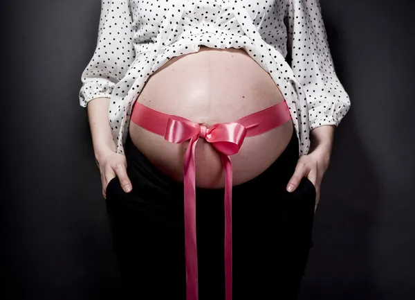 Belly with bow — Stock Photo, Image