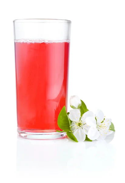 Glass of cherry juice and flowers isolated on white background — Stock Photo, Image