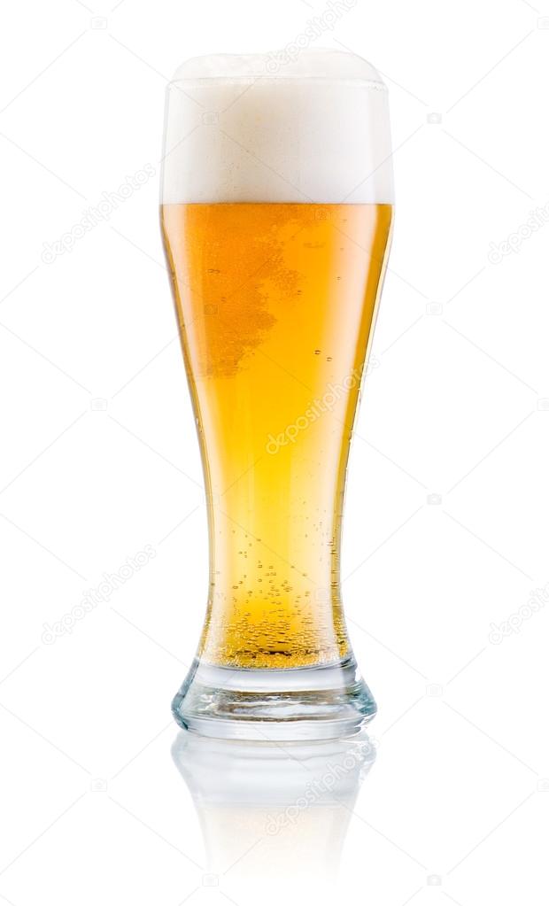 Glass of fresh beer with cap of foam isolated on a white backgro