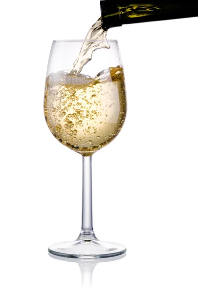 Pouring a glass of white wine isolated on a white background — Stock Photo, Image