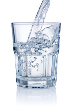 Water pouring into glasses isolated on a white background clipart