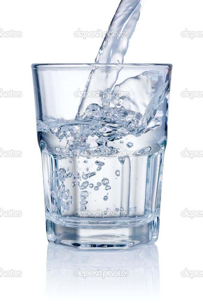 Water pouring into glasses isolated on a white background