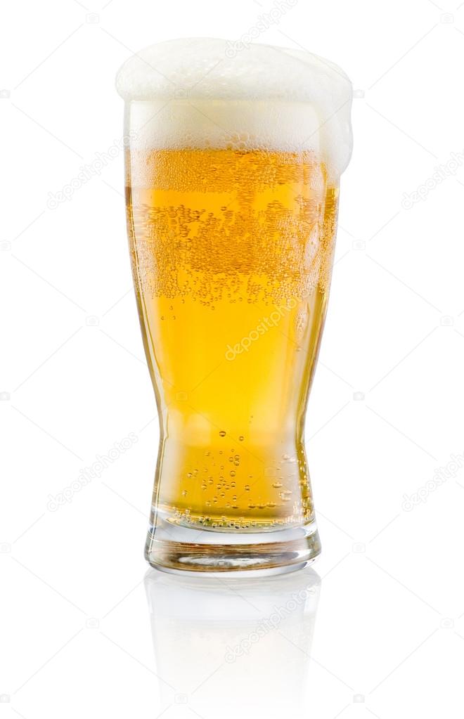 Glass of fresh beer with cap of foam isolated on white backgroun