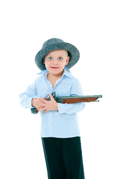 Boy in a hat with gun — Stock Photo, Image