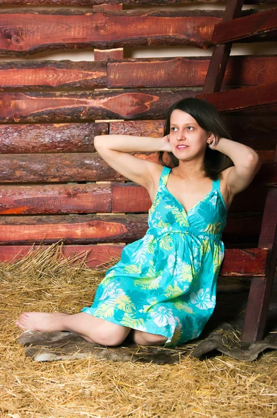 Girl lying on hay — Stock fotografie