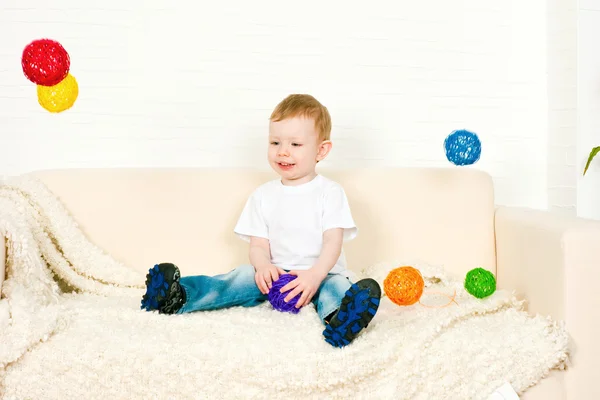 The little boy and flying spheres — Stock Photo, Image