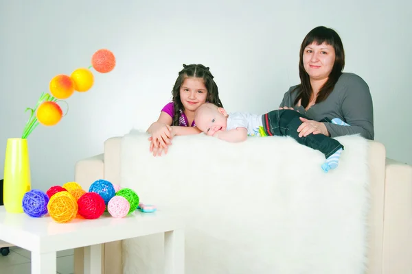 Happy young woman with two children — Stock Photo, Image