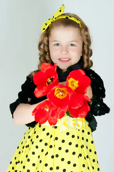 Girl with a bouquet of tulips — Stock Photo, Image