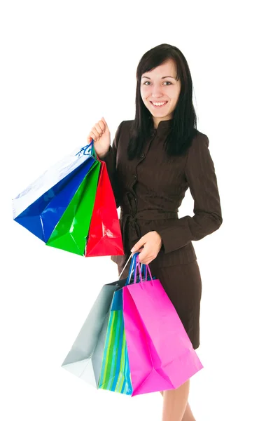 La muchacha en el traje de trabajo con las compras —  Fotos de Stock