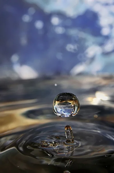 Earth in drop of water. — Stock Photo, Image