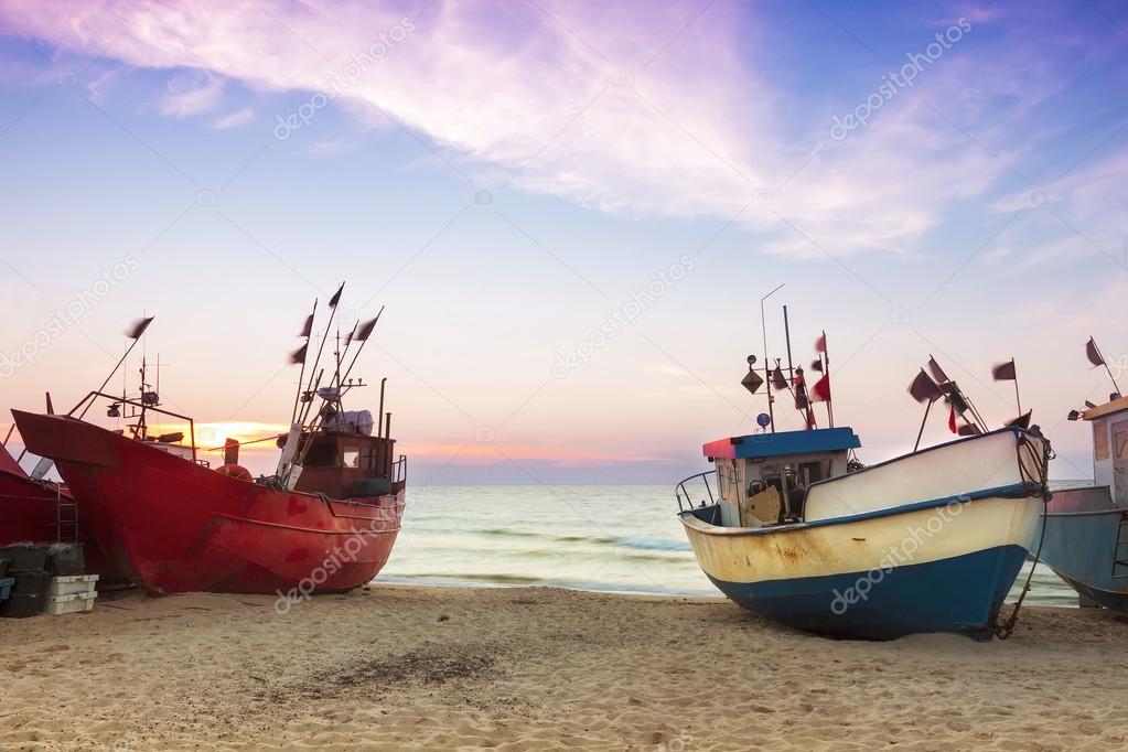 Sights of Poland. Sunset at Baltic sea with fishing boats.