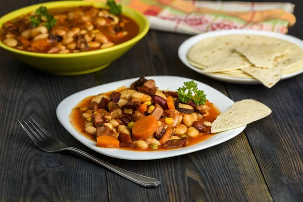 Mexican style beans on wooden table