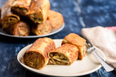 potato rolls with bacon, mushrooms and onion