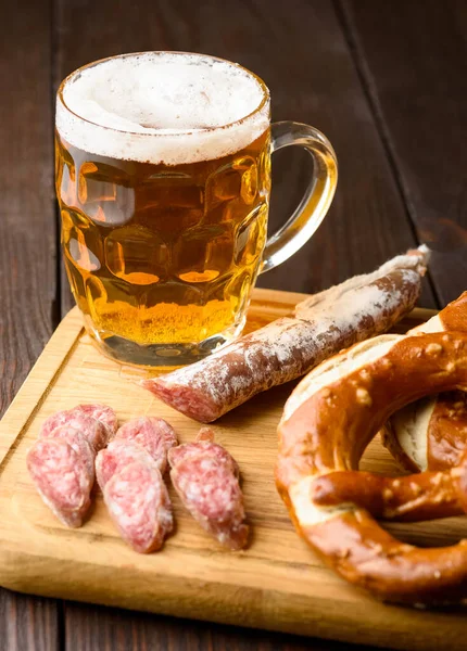 traditional mug of beer and pretzels - light or dark beer