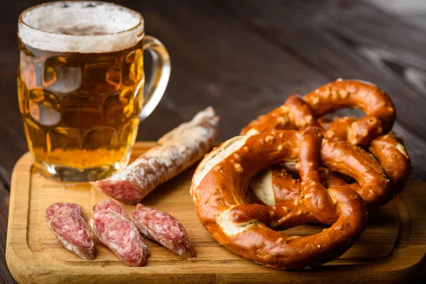 traditional mug of beer and pretzels - light or dark beer