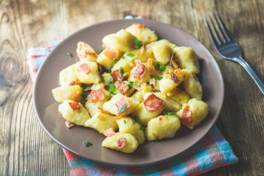 dumplings with bacon - a photo in a rustic style