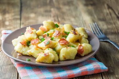 dumplings with bacon - a photo in a rustic style