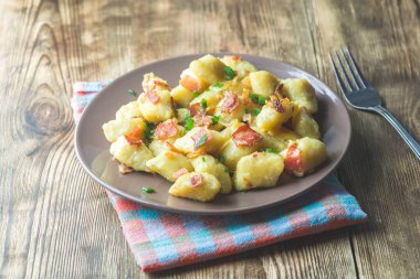 dumplings with bacon - a photo in a rustic style