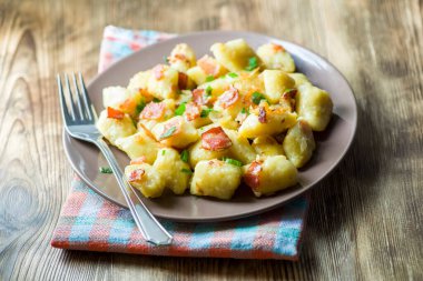 dumplings with bacon - a photo in a rustic style