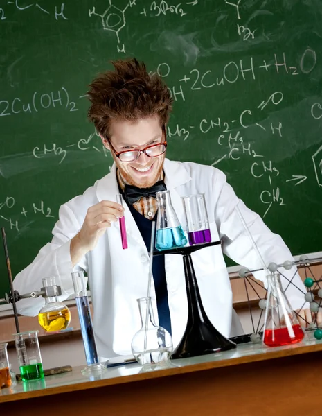 Mad professor holds a vial Royalty Free Stock Images