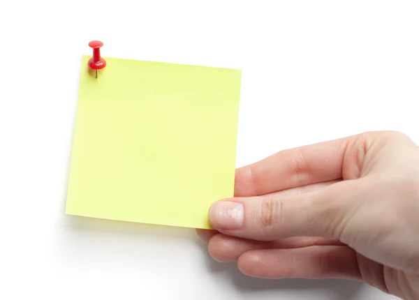 Hand with yellow sticky note — Stock Photo, Image