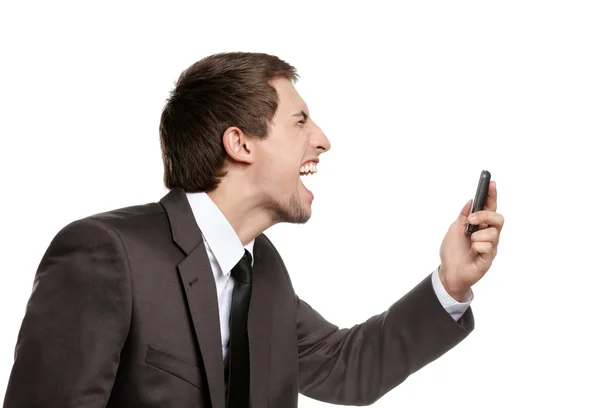 Naštvaný obchodní muž křičí na mobil — Stock fotografie