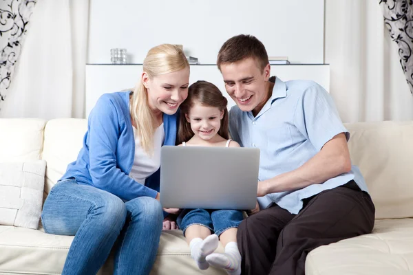 Happy family make purchases through the internet — Stock Photo, Image