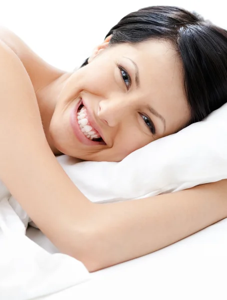 Laughing sexy woman tries to fall asleep — Stock Photo, Image