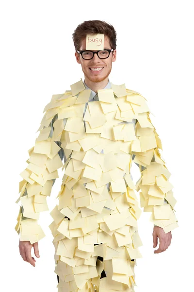 Young man with a sticky note on his face, covered with yellow stickers — Stock Photo, Image