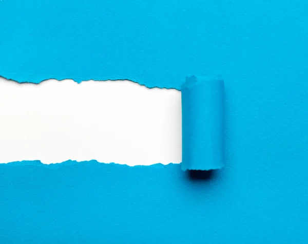 Torn blue paper with white space for your message — Stock Photo, Image