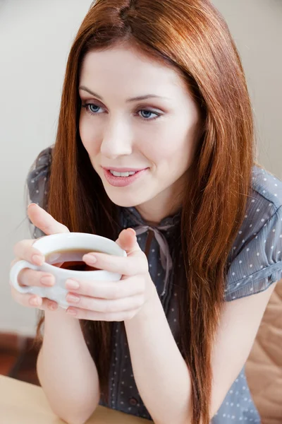 Beautiful woman with cup of tea — Stock Photo, Image